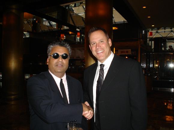 Ali Karim acting as Vince Flynn's Bodyguard